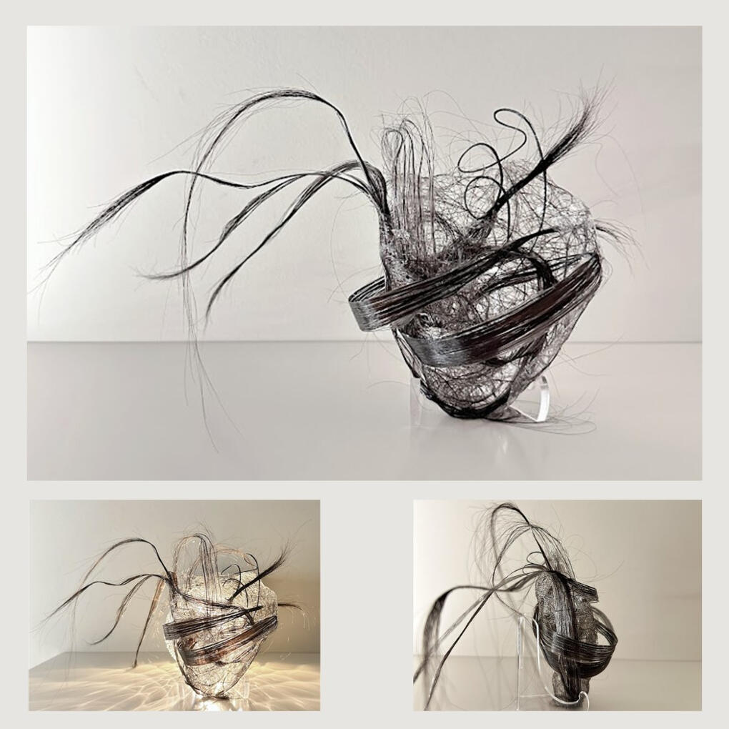 This sculpture was made by weaving and gluing real human hair into the shape of a heart. When lit, the hair’s delicate texture shines through, symbolizing fragility, memory, and connection.